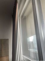 Curtain edge showing coloured front and white lining