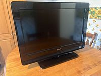 Front view of Sony Bravia 26" LCD TV on stand
