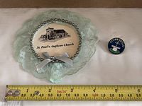 Front view of magnet and pin with ruler for scale