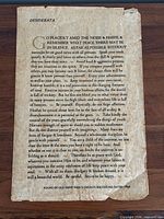 Full view of vintage Desiderata parchment poster on wood surface