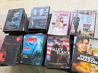 Stacks of DVD cases showing several titles