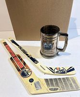 Two Edmonton Oilers mini sticks and smoked glass mug stein