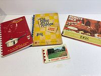 All four vintage booklets laid out