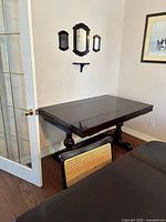 Buffet table closed, trestle base visible