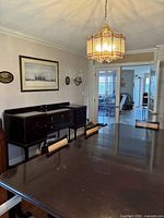 Full dining room view showing sideboard against wall behind table