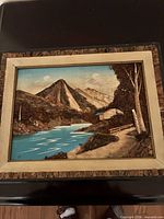 River, bridge, cabin diorama in frame