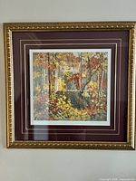 Front view of framed print showing artwork, mats and gold frame
