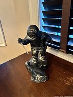 Hunter with seal carving front view