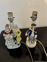 Both porcelain figural lamps side by side showing overall form and wiring