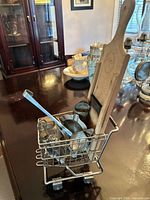 lot overview, cart holding several vintage kitchen tools
