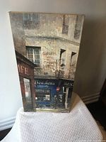 Front view of complete canvas showing French storefront artwork
