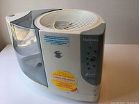 Right-front view showing control panel, water tank and overall unit