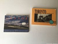 Front covers of both postcard books
