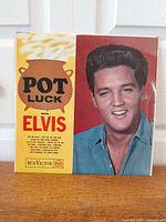 Front album cover showing title and Elvis portrait