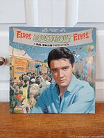 Front cover of Elvis Presley Roustabout LP showing portrait and carnival artwork