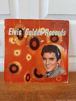 Front cover of Elvis' Golden Records LP showing artwork and wear