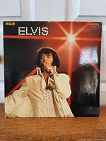 Front album cover showing Elvis performing