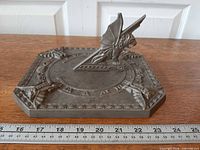 Top angle showing entire octagonal sundial with ruler for scale