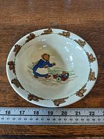 Top view showing full bowl, teddy bear border and central scene