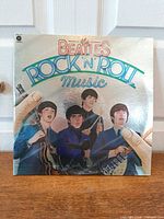 Front view of silver-foil LP jacket showing Beatles illustration and title