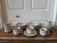 Full set arranged showing mugs, bowls and saucers