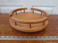 Top view showing circular oak surface and spindle rail