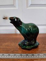 Left-front view of ceramic polar bear showing glaze and form