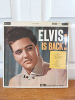 Front album cover showing Elvis portrait and title