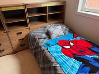 Bed frame with drawers, mattress, bedding, adjacent cabinets