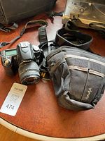 Nikon D80 with Sigma lens, strap, soft case visible together