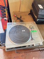Top view of Baycrest Plus 3200 turntable showing platter, tonearm and cracked dust cover