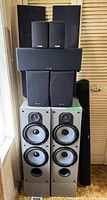 Front view showing stacked Polk speakers on Paradigm towers