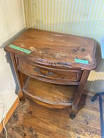 First table showing top, drawer, shelf, front legs and surface damage