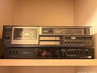 Sony TC-FX420R cassette deck stacked on Sansui AT-700 timer