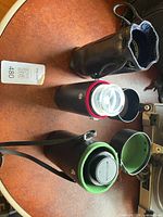 Three lens cases containing Soligor, Tamron and Canon lenses