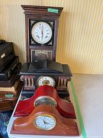 Stacked view of all four clocks showing styles and finishes