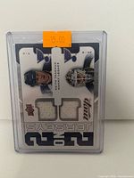 Front of card with Tkachuk and Legace jersey swatches