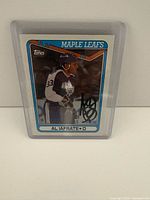 Front view of autographed Al Iafrate Topps Maple Leafs trading card in sleeve