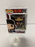 Front view of boxed Angus Young Funko Pop
