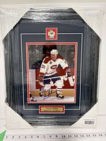 Front view of framed Chris Nilan signed photo