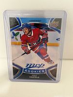 Front of Cole Caufield MVP Rookie Card in holder