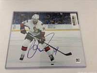 Autographed 8x10 photo with visible signature and hologram