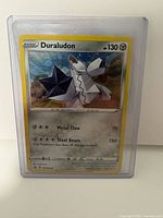 Front view of Duraludon holofoil card in sleeve