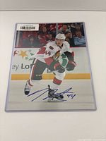 Full view of signed photo in sleeve