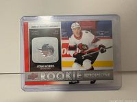 Front of Josh Norris Rookie Retrospective card in plastic holder