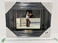 Front view of framed Ken Dryden photo with nameplate, shrink-wrapped
