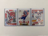 Front view of three Wayne Gretzky Hockey Heroes cards in sleeves