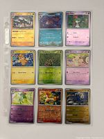 Binder page showing all nine Pokémon reverse-holo cards