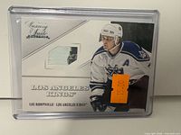 Front of Panini Luxury Suite Luc Robitaille card with stick fragment visible