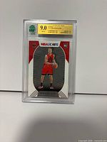 Front view of graded Malachi Flynn rookie card in slab showing gold MNT 9.0 label